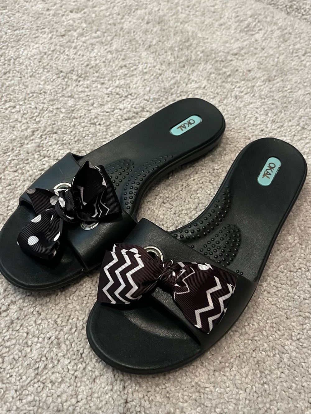 Oka-B Black Bow Slide Sandals with Patterned Accent